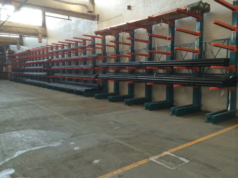 Long materials stored across a cantilever rack run