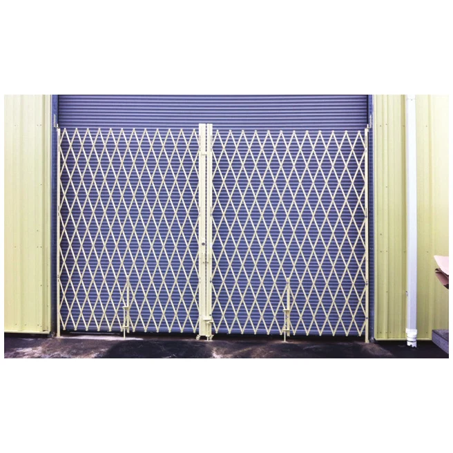Double galvanized folding security gate across an overhead door