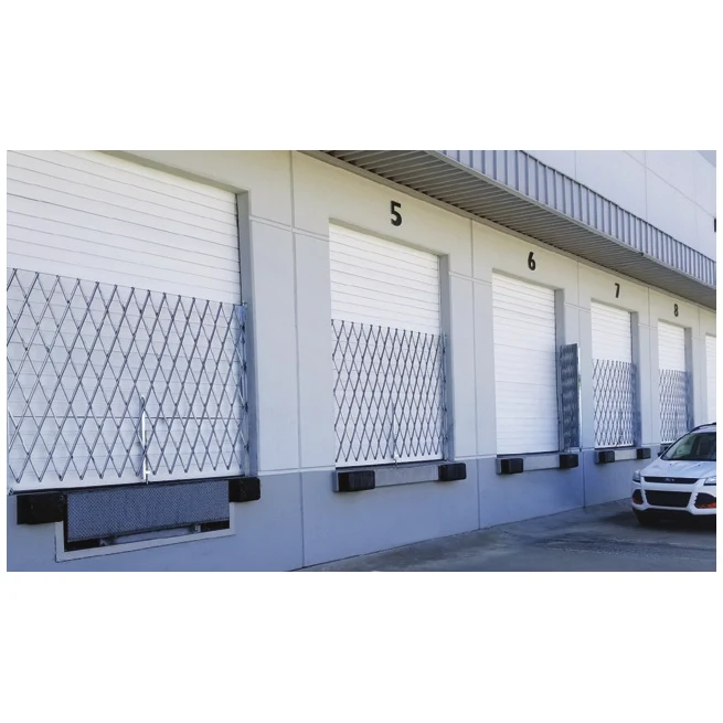 Folding security gates on a row of loading dock doors