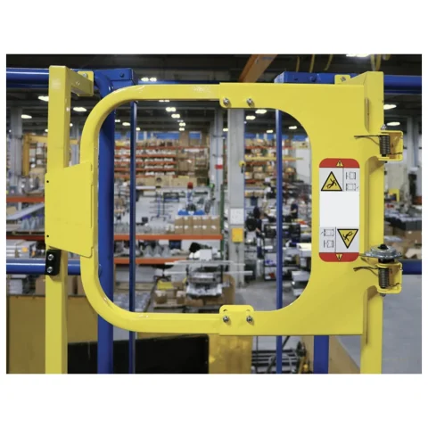Yellow self-closing ladder safety gate mounted at a platform opening