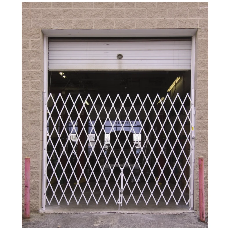 Single galvanized folding security gate across an overhead door