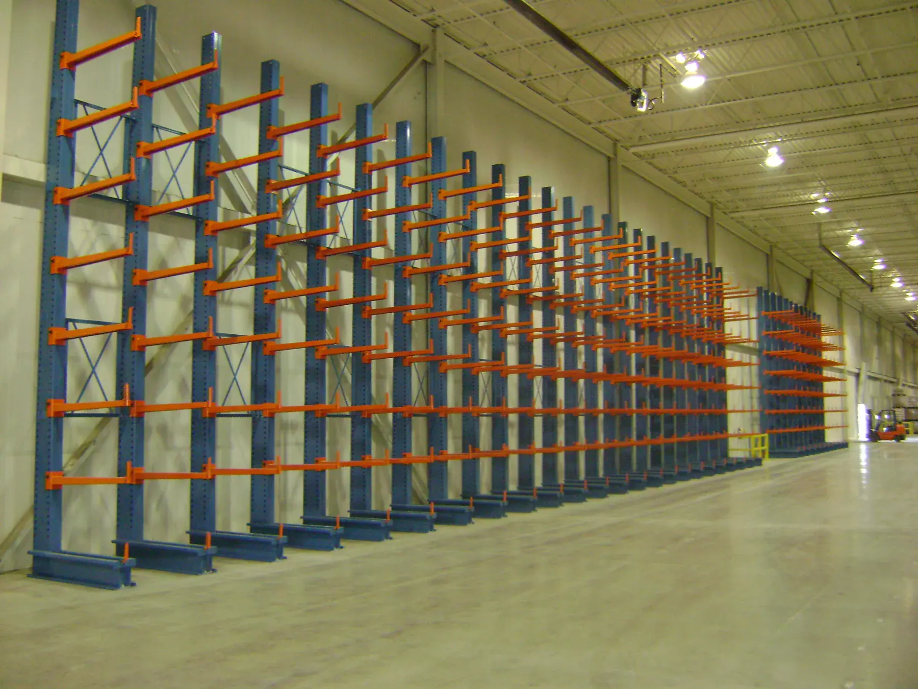 Single-sided cantilever installation along a warehouse wall