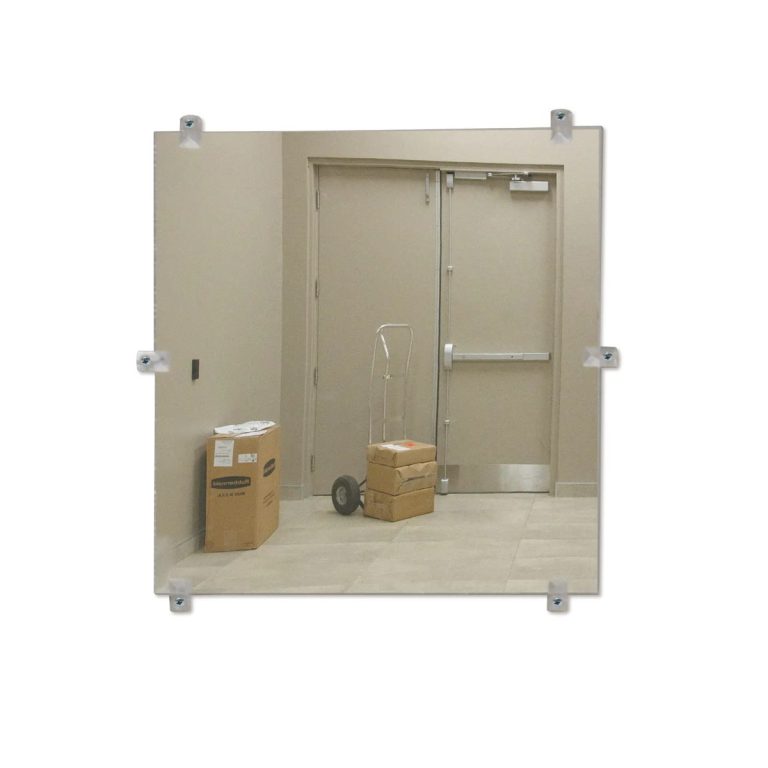 Unframed flat mirror mounted on a wall
