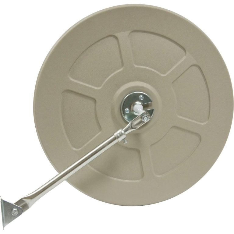 Back of a beige convex mirror with telescopic arm