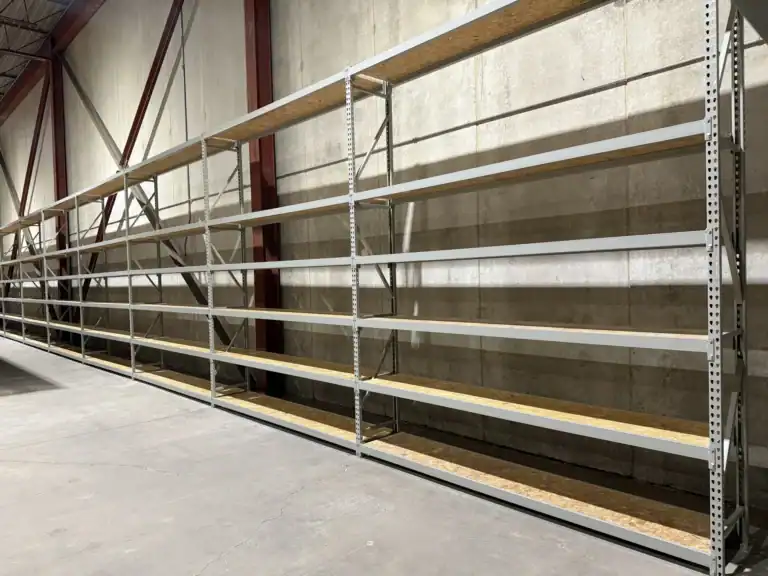 Long run of wide span shelving with wood decks