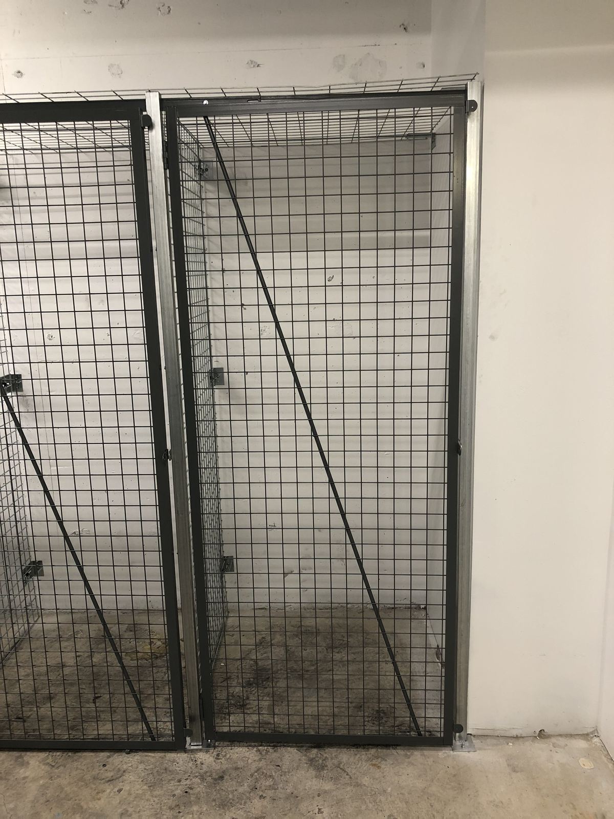 Close-up of wire mesh locker doors