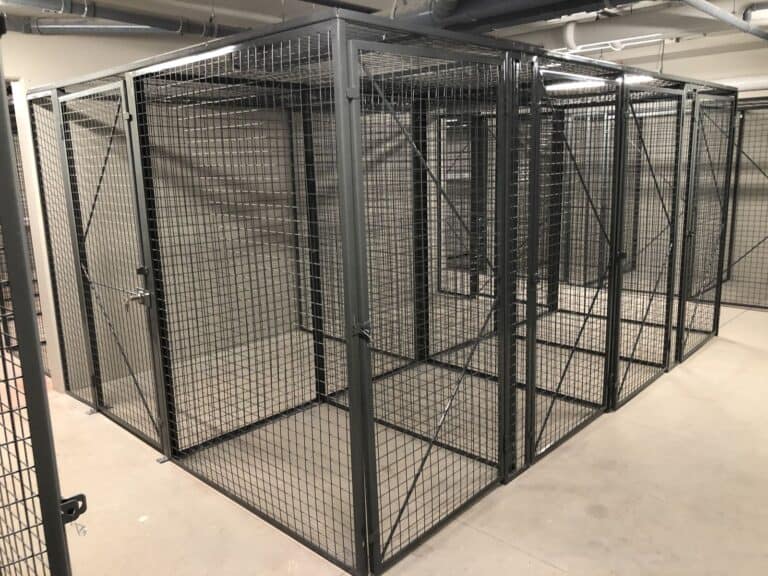 Row of framed wire mesh storage lockers with doors