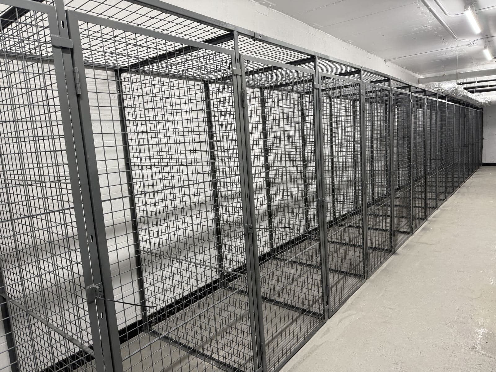 Long row of wire mesh tenant storage lockers